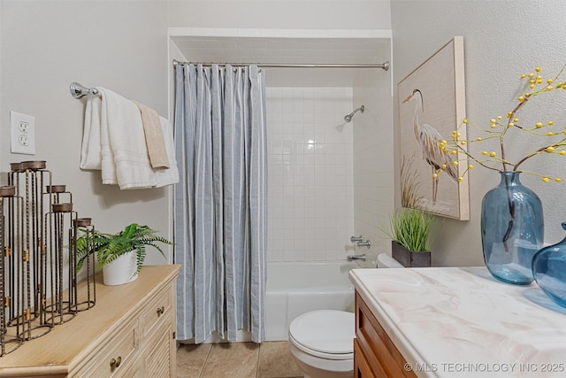 full bathroom with vanity, tile patterned floors, toilet, and shower / bath combo