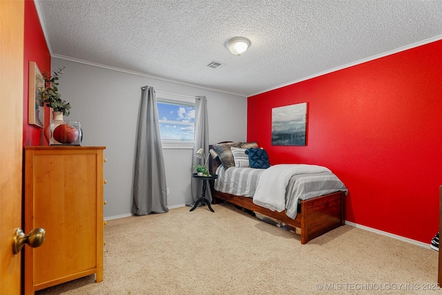 bedroom featuring visible vents, carpet floors, and ornamental molding