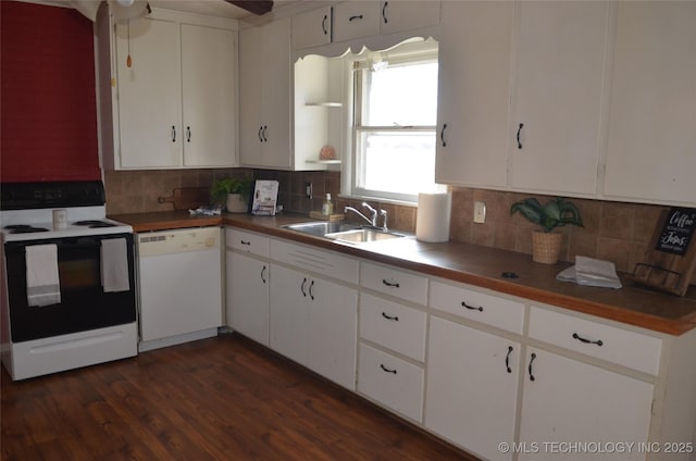 kitchen featuring a sink, range with electric stovetop, decorative backsplash, and white dishwasher