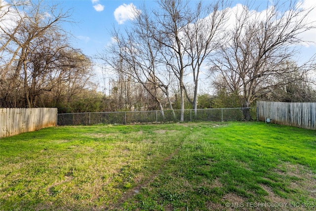 view of yard with a fenced backyard