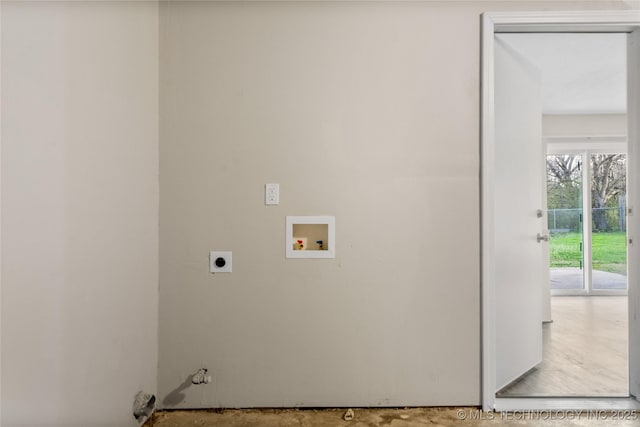 washroom with hookup for an electric dryer, hookup for a washing machine, and laundry area