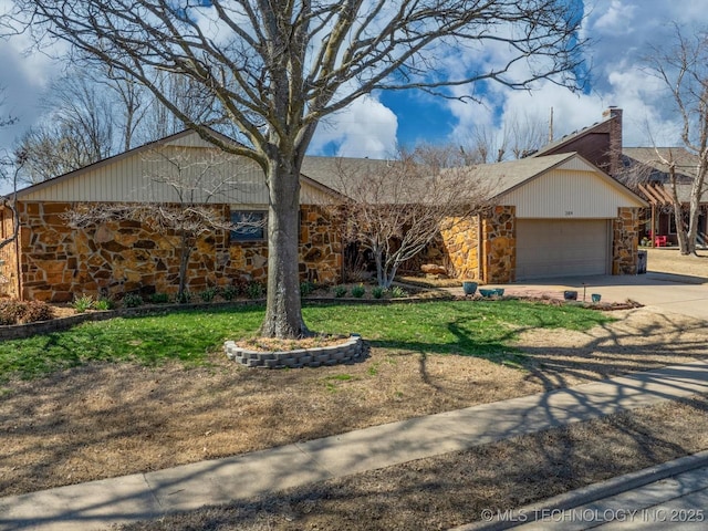 view of front of home with a front lawn, a chimney, a garage, stone siding, and driveway