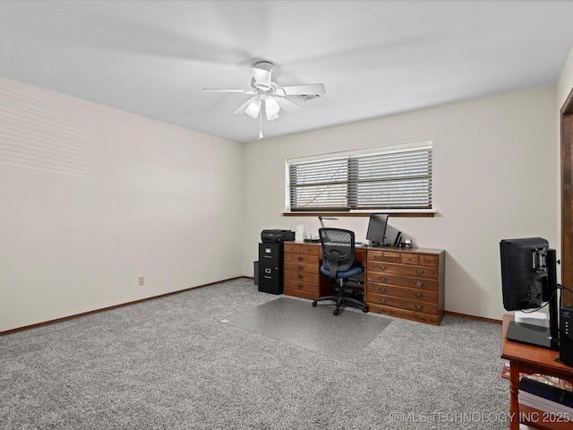 home office with carpet flooring, a ceiling fan, and baseboards