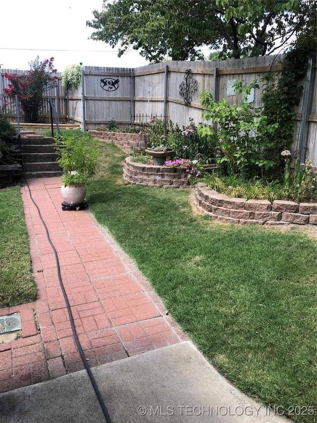 view of yard with a fenced backyard