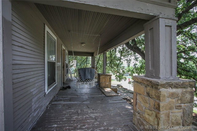 301 N Cleveland Ave, Sand Springs, OK 74063 - wooden deck featuring covered porch
