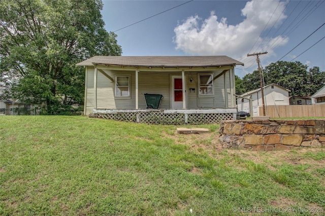 301 N Cleveland Ave, Sand Springs, OK 74063 - view of front facade with a front yard, fence, and covered porch