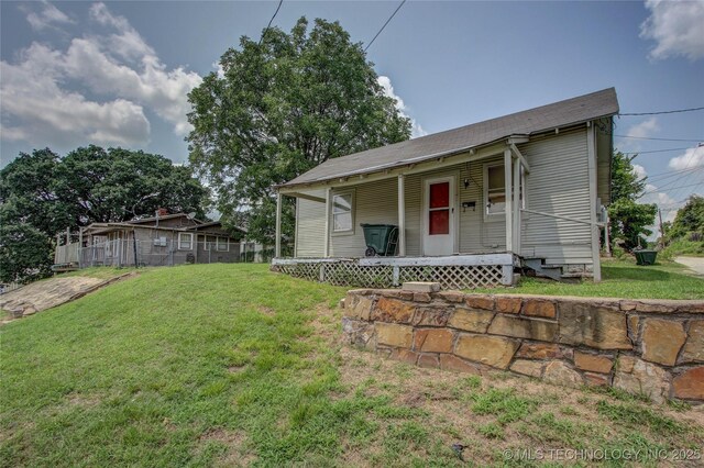 301 N Cleveland Ave, Sand Springs, OK 74063 - view of front of property with a porch and a front lawn