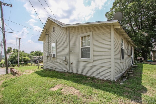 301 N Cleveland Ave, Sand Springs, OK 74063 - view of home's exterior featuring a yard