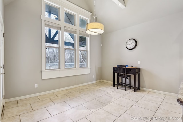 unfurnished dining area featuring tile patterned floors and baseboards