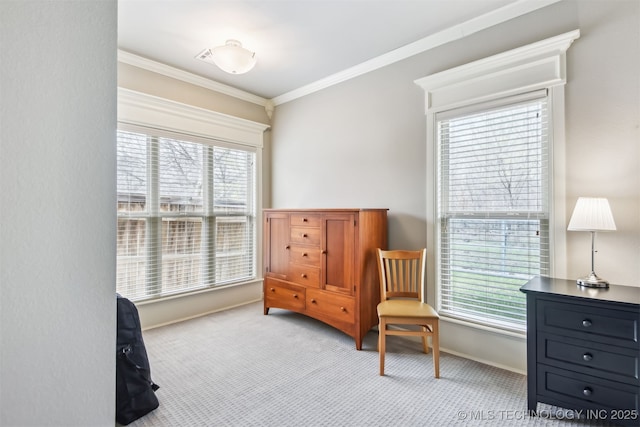 living area with baseboards, carpet floors, and ornamental molding