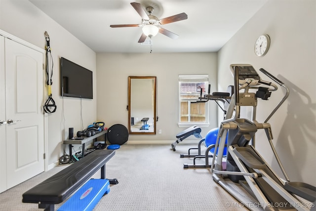 workout area with baseboards, carpet, and ceiling fan