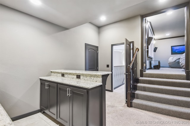 interior space featuring recessed lighting, stairway, baseboards, and light carpet