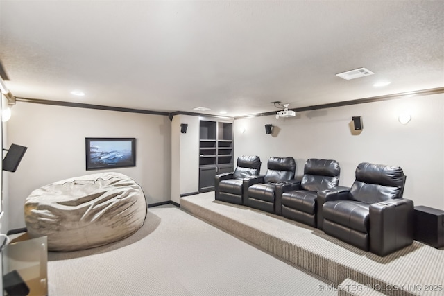 cinema room with recessed lighting, visible vents, ornamental molding, carpet floors, and baseboards