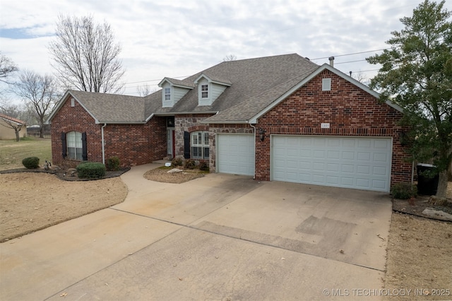 view of front of home featuring concrete driveway, brick siding, a garage, and roof with shingles
