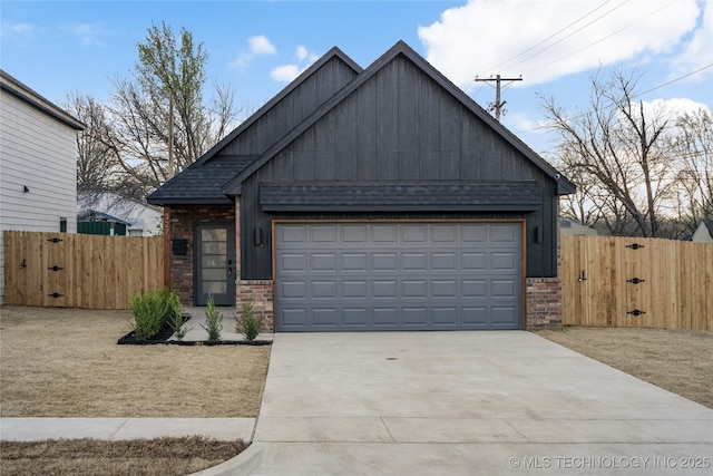 view of front of home featuring a gate, fence, driveway, an attached garage, and a shingled roof
