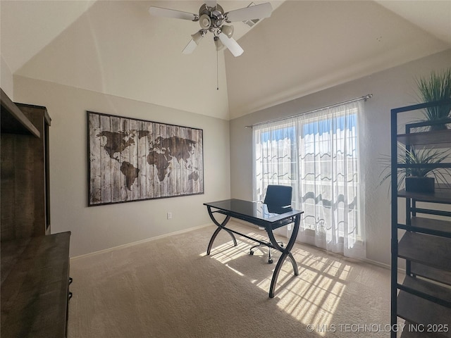 carpeted home office featuring a ceiling fan, baseboards, and high vaulted ceiling