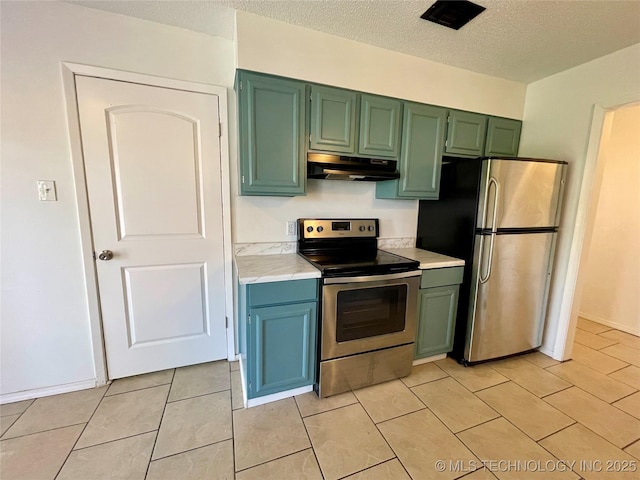 kitchen with under cabinet range hood, appliances with stainless steel finishes, light countertops, and green cabinetry