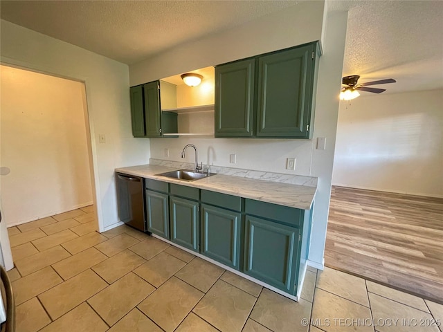 kitchen with ceiling fan, a sink, light countertops, dishwasher, and green cabinets