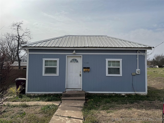 view of outdoor structure with entry steps and an outbuilding