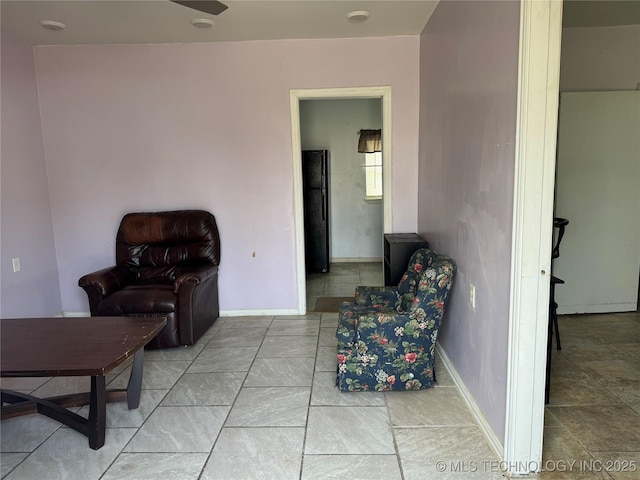 sitting room featuring baseboards