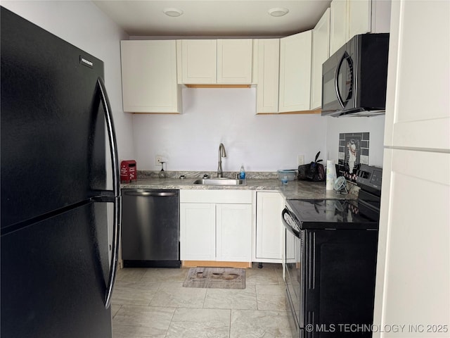 kitchen featuring white cabinetry, black appliances, and a sink