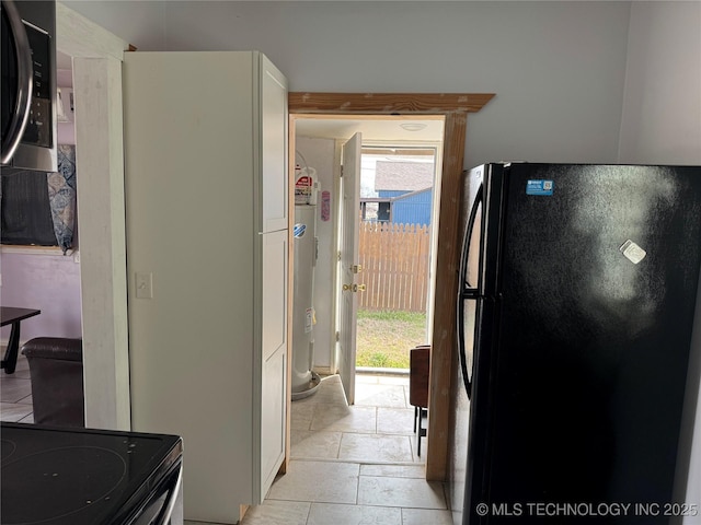 kitchen featuring black appliances and a healthy amount of sunlight