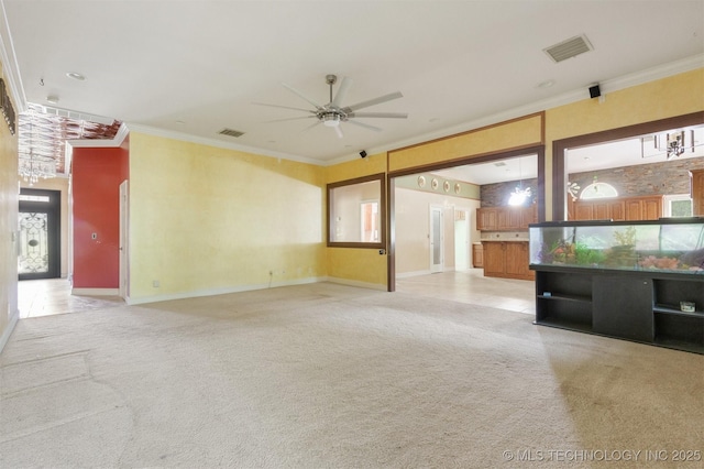 unfurnished living room with light carpet, visible vents, and ceiling fan