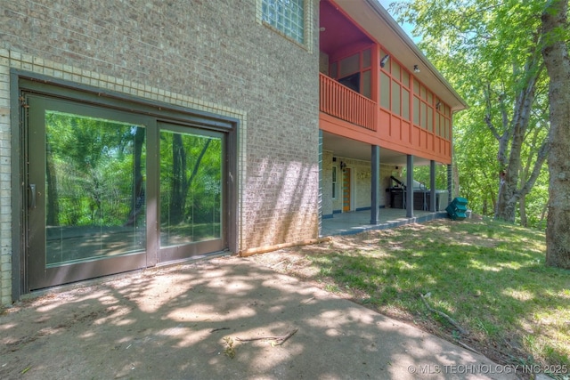 rear view of property featuring a patio area