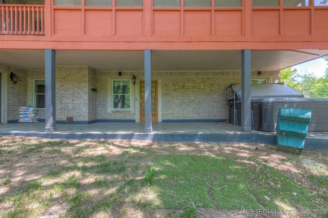 property entrance with brick siding