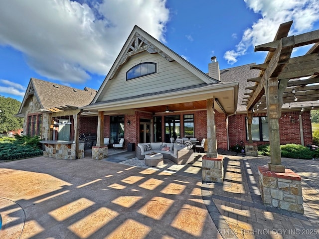 exterior space featuring a ceiling fan, a pergola, a patio, an outdoor hangout area, and brick siding