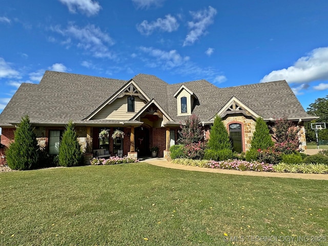craftsman house with brick siding, roof with shingles, and a front lawn
