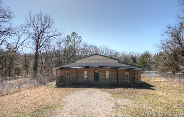 136 Pine St, Mead, OK 73449 - exterior space featuring a porch and a fenced backyard