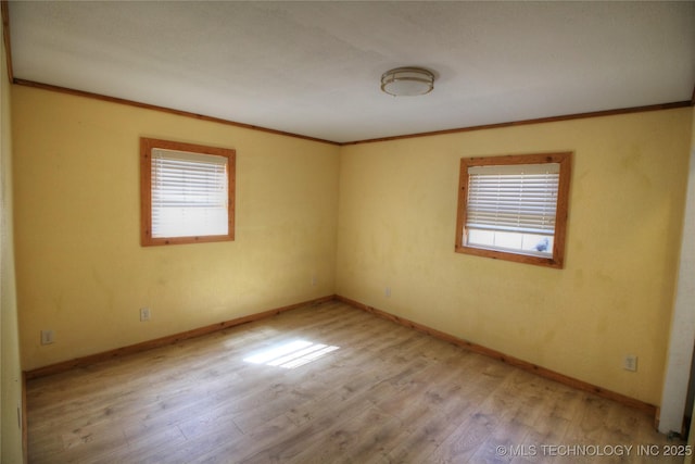 136 Pine St, Mead, OK 73449 - spare room with baseboards, light wood-style flooring, and crown molding