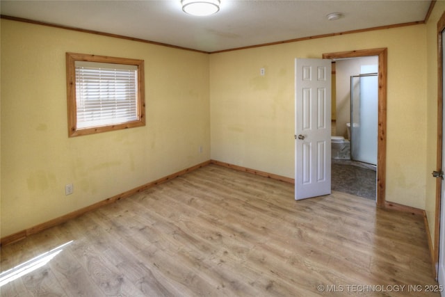 136 Pine St, Mead, OK 73449 - empty room featuring baseboards, wood finished floors, and ornamental molding
