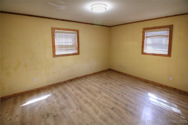 136 Pine St, Mead, OK 73449 - unfurnished room with baseboards, light wood-style floors, and ornamental molding