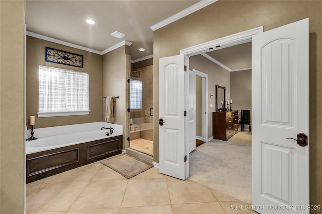 full bath with a stall shower, crown molding, tile patterned flooring, baseboards, and a bath