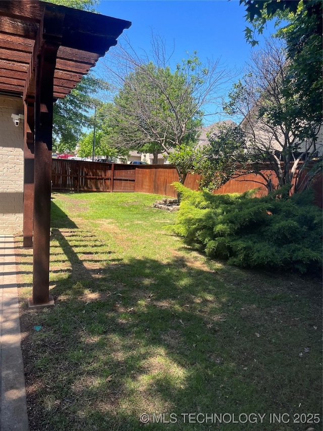 view of yard with a fenced backyard
