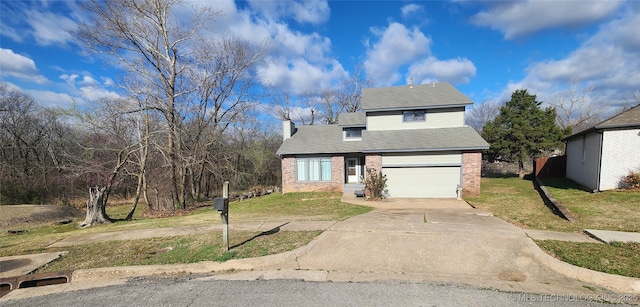 305 E 48th Pl, Sand Springs, OK 74063 - traditional home with a front yard, a chimney, brick siding, and concrete driveway