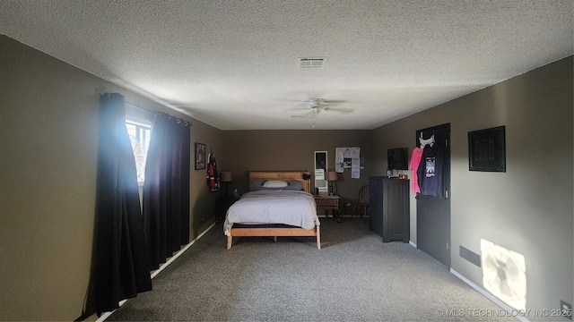 305 E 48th Pl, Sand Springs, OK 74063 - carpeted bedroom featuring a textured ceiling, ceiling fan, baseboards, and visible vents