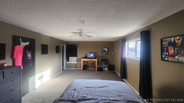 305 E 48th Pl, Sand Springs, OK 74063 - carpeted bedroom featuring a textured ceiling, baseboards, a ceiling fan, and visible vents