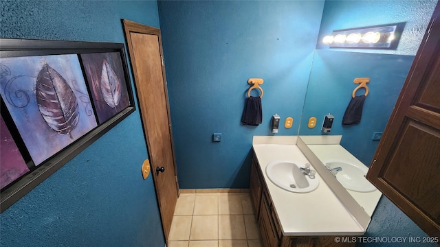 305 E 48th Pl, Sand Springs, OK 74063 - bathroom featuring tile patterned floors, vanity, and baseboards
