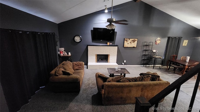 305 E 48th Pl, Sand Springs, OK 74063 - living area with high vaulted ceiling, ceiling fan, a fireplace, carpet floors, and baseboards