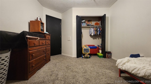 305 E 48th Pl, Sand Springs, OK 74063 - bedroom with carpet floors, baseboards, a closet, and a textured ceiling