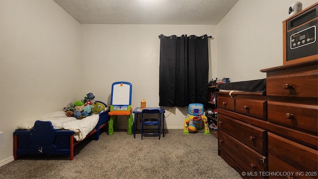 305 E 48th Pl, Sand Springs, OK 74063 - carpeted bedroom with baseboards and a textured ceiling