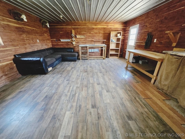 020 Haworth, Durant, OK 74701 - unfurnished living room featuring wooden walls and wood finished floors