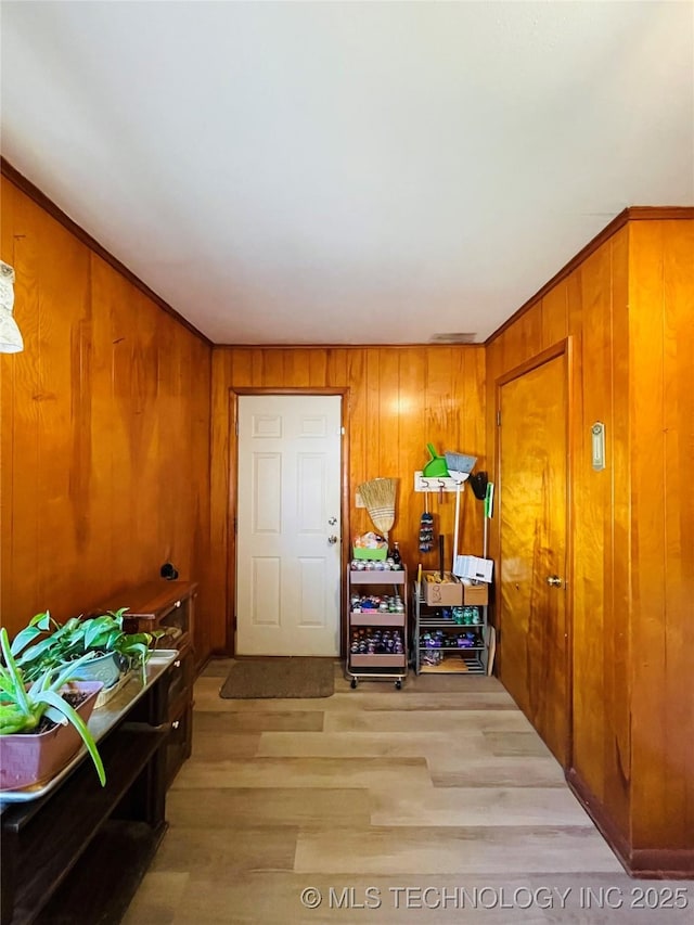 306 N Cherokee St, Beggs, OK 74421 - hallway with wooden walls and wood finished floors