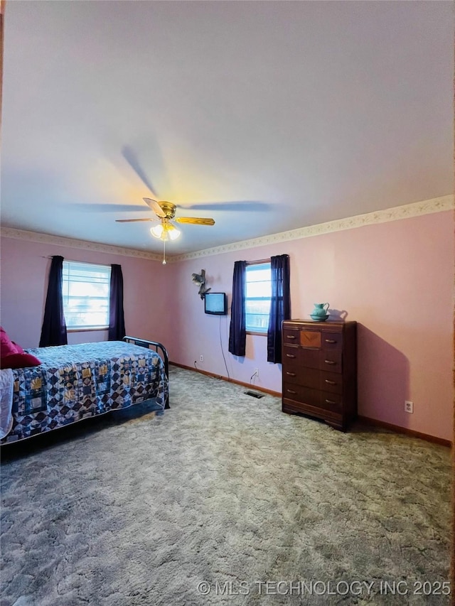 306 N Cherokee St, Beggs, OK 74421 - carpeted bedroom with visible vents, baseboards, and ceiling fan