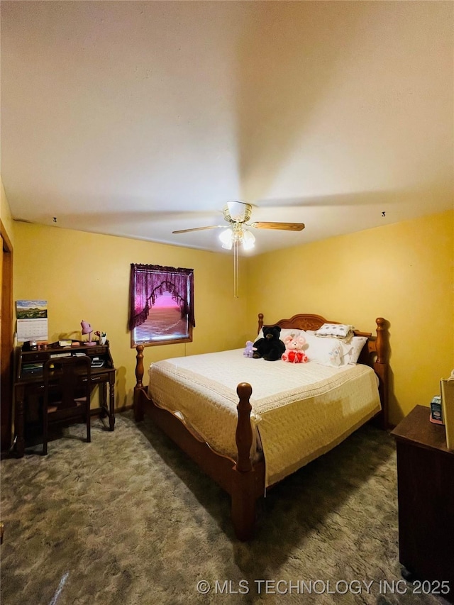 306 N Cherokee St, Beggs, OK 74421 - bedroom with dark colored carpet and a ceiling fan