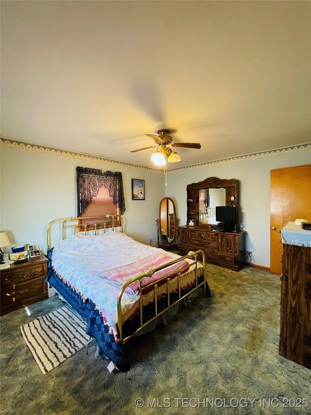 306 N Cherokee St, Beggs, OK 74421 - bedroom featuring ceiling fan and carpet flooring
