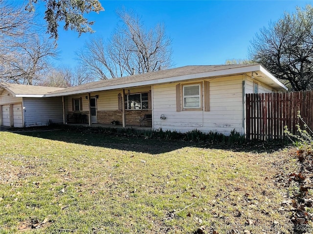 306 N Cherokee St, Beggs, OK 74421 - single story home featuring a garage, a porch, a front lawn, and fence